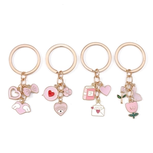 Pink heart and rabbit charm keychains in rose gold plating for bags and keys