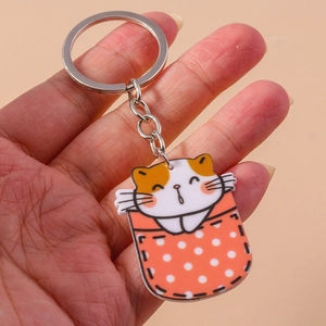 Porte-clés chat mignon en acrylique avec poche à pois orange et pendentif argenté