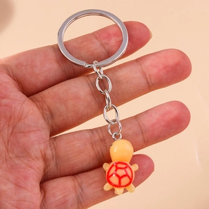 Cute cartoon turtle keychain with red shell pattern and silver metal ring for bags