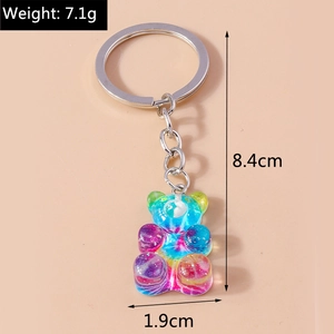 Détails d'un porte-clés ours en résine dégradée avec dimensions et chaîne en argent