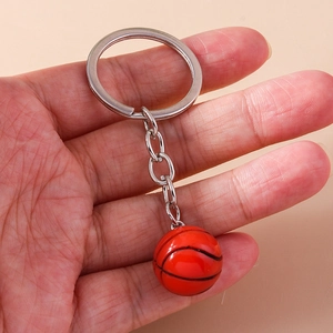 Portachiavi mini basket con sfera arancione testurizzata e anello metallico argento