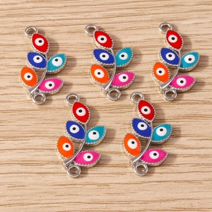 Detailed view of colorful evil eye leaf charms with silver finish and dual loops