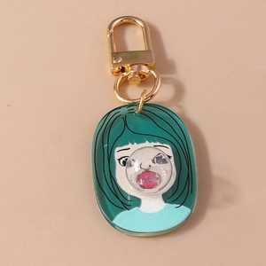 Detail view of acrylic keychain featuring a green-haired girl and 3D clear bubble dome
