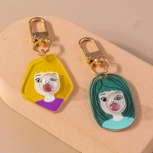 Creative cartoon acrylic keychains featuring girls blowing bubbles with gold lobster clasps
