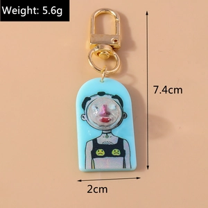 Detail view of blue acrylic keychain with golden D-ring showing size and 5.6g weight
