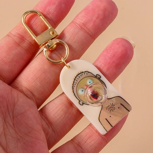 Funny cartoon character keychain with soft silicone bubble nose stress relief feature