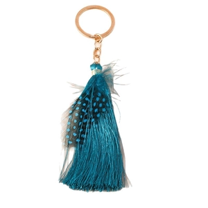 Bohemian peacock blue feather tassel keychain with golden metal ring on white background