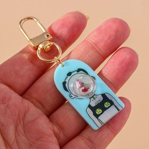 Detail of creative acrylic pendant with artistic figure and golden metal lobster clasp