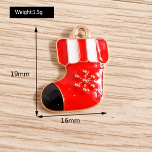 Detail of red Christmas stocking pendant with gold snowflake pattern and dimensions