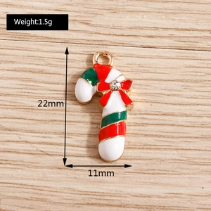 Detail view showing 22mm x 11mm red and white candy cane pendant charm for DIY jewelry