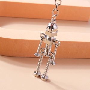 Macro shot of silver robot keychain made from industrial metal screws and nuts