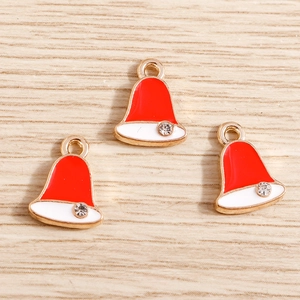 Detailed close-up of three red and white enamel Christmas hat metal charms with a single crystal