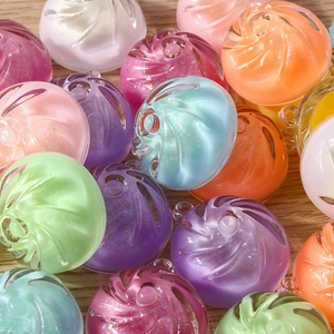 Macro shot of colorful pastel macaron resin beads with glitter for DIY jewelry making