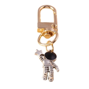 Creative astronaut keychain with golden D-ring and silver space man holding a star