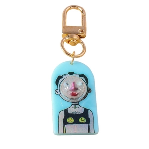 Creative blue acrylic keychain with bubble boy illustration and golden metal clip