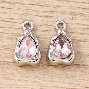 Detail of pink pear-cut gemstone pendants with silver metal settings for DIY jewelry making