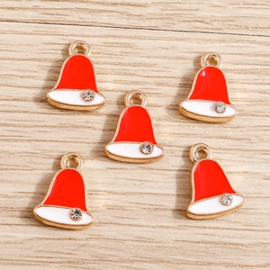 Detailed view of red and white enamel Santa hat charms with gold trim and small rhinestones