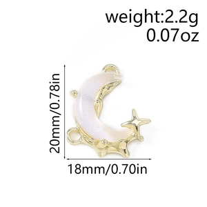 Detailed size view of moon and star charms with white pearlescent inlay and gold base