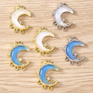 Golden and silver crescent moon charms with star and crystal accents for jewelry making