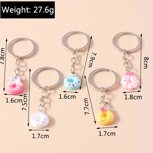 Detailed view of five creative donut keychains with cute resin charms and metal rings
