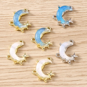 Crescent moon and star charms in blue glitter and pearl white with gold and silver finish