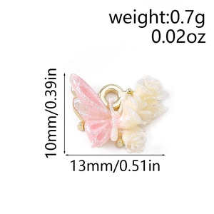 Macro shot of pink gradient butterfly charm with 10x13mm size and 0.7g weight info