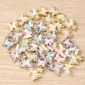 Colorful rhinestone butterfly charms with resin flowers for DIY jewelry making