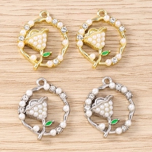 Detailed view of rhinestone flower pendants with pearls for DIY jewelry making