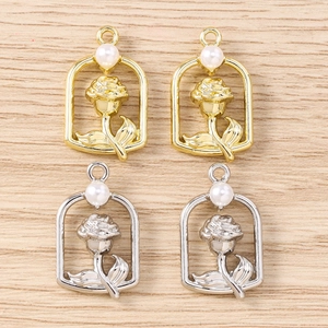 Detail of DIY floral pendants with white pearls in gold and silver finish