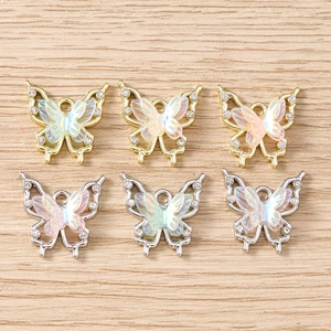Detail of butterfly charms with iridescent wings and rhinestones for DIY jewelry making