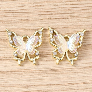 Detail of butterfly jewelry pendants with rhinestones and colorful resin for DIY