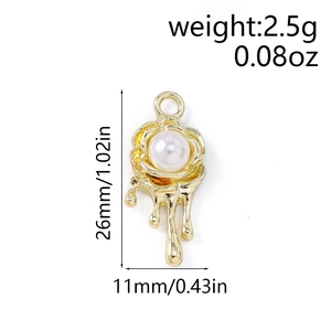 Close-up of golden rose flower pendant with white pearl and liquid metal drips 26mm x 11mm
