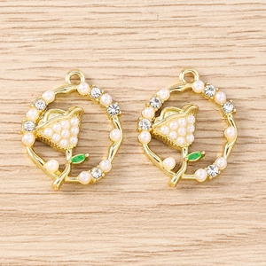 Macro detail of tulip flower pendant with rhinestones and white pearls for jewelry making