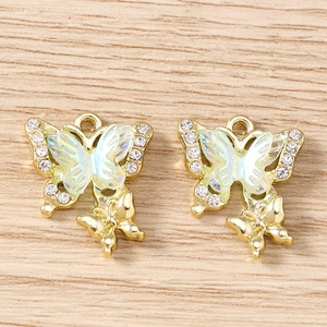 Detail of DIY butterfly charms with colorful crystals and golden metallic plating