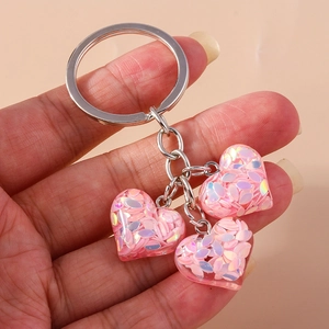 Porte-clés cœur tendance avec breloques pailletées roses et anneau argenté poli