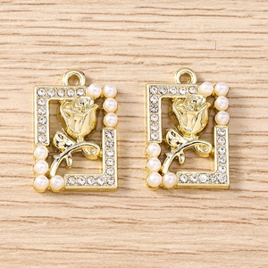 Detail of golden rectangle rose pendants with pearls and rhinestones for DIY jewelry