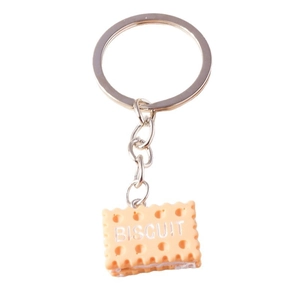 Creative realistic biscuit shaped keychain with silver metal ring on white background
