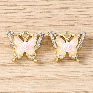 Detail of butterfly charms with pink rose and rhinestones for DIY jewelry making