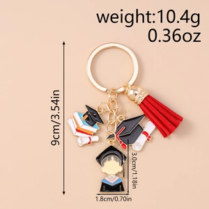 Detailed view of graduation keychain with tassel and dimensions on light background