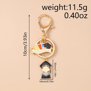 Detail view showing Graduation keychain with golden charm and cartoon student figure
