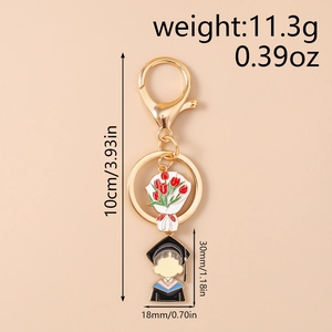 Detail view of graduation keychain featuring bouquet and cartoon boy charms with size info