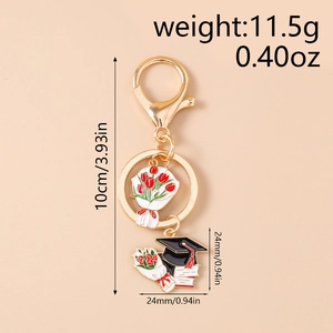 Detailed view of graduation enamel keychain with bouquet and cap pendant dimensions