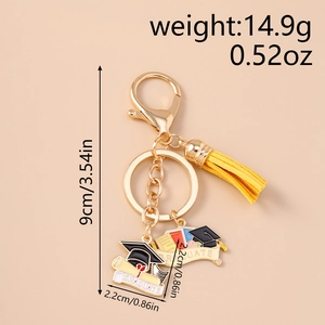Detail showing graduation metal keychain with yellow tassel and dimensions for sizing
