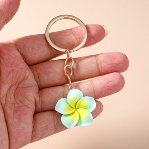 Sweet plumeria keychain with green to yellow gradient finish and gold metal ring