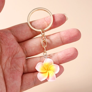 Sweet plumeria flower keychain with gradient resin petals and golden metal keyring