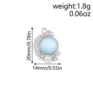 Star and moon pendant detail with blue stone, small pearls and sparkling rhinestones