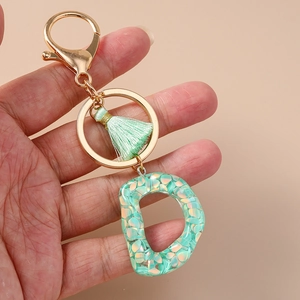 Letter D alphabet keychain with mint green resin sequin and stylish silk tassel