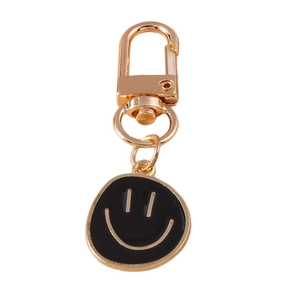 Porte-clés créatif mousqueton doré avec un pendentif smiley en émail noir minimaliste