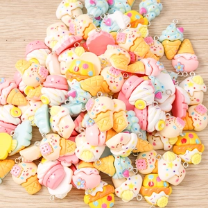 Macro detail of mixed resin ice cream and dessert charms for DIY jewelry making