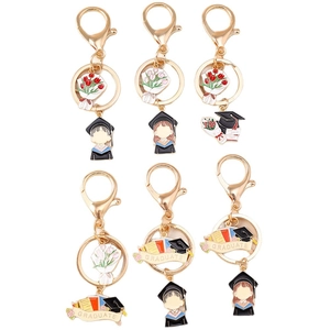 Golden graduation keychain set featuring 6 unique designs with graduate figures and floral motifs